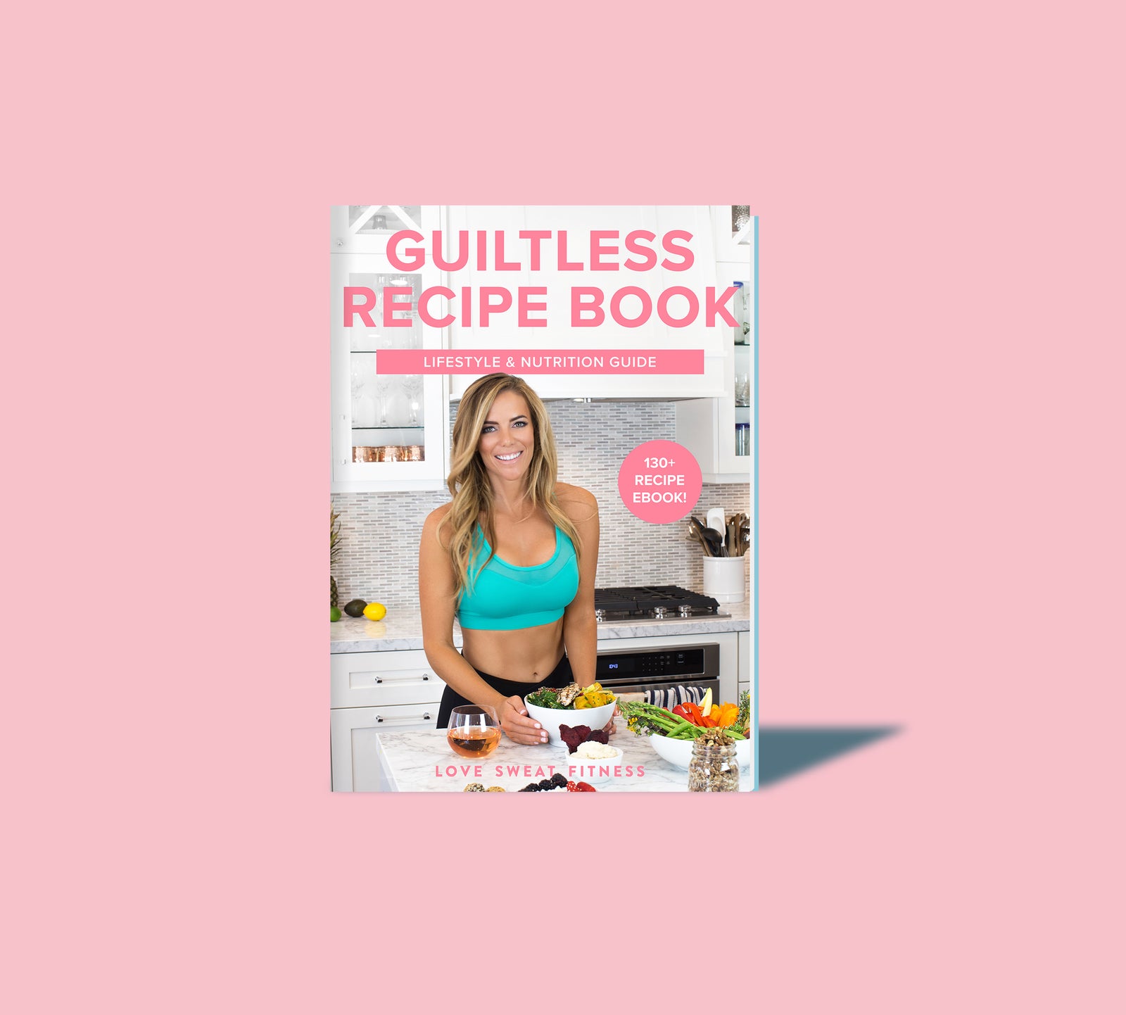 Cover of the 'Guiltless Nutrition Recipe Book' featuring an image of a woman in a kitchen with various fruits and vegetables, indicating healthy eating and lifestyle content.