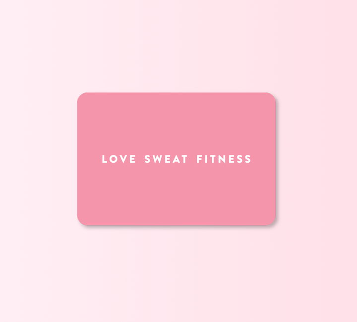 A pink gift card with the text 'LOVE SWEAT FITNESS' written in white, indicating a theme of love and fitness.