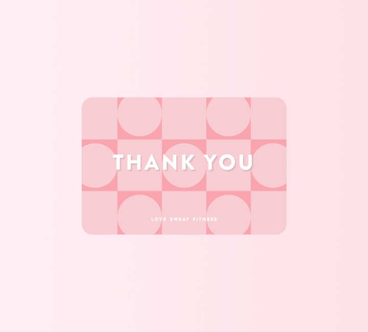 A pink gift card with the text 'LOVE SWEAT FITNESS' written in white, indicating a theme of love and fitness.
